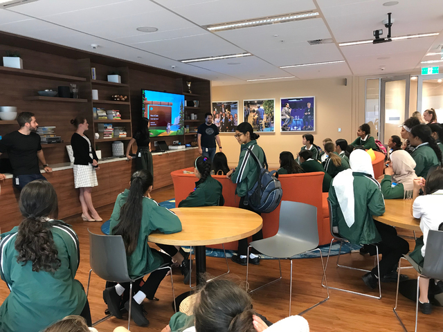 Salesforce employees support STEM education through volunteering to share about their careers in visits to local schools.