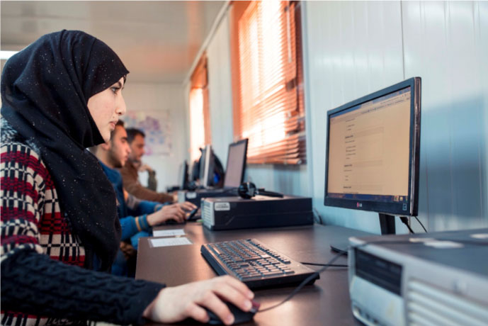 Access to on-demand digital training and mentorship help refugees find jobs worthy of their talents in their new homeland. Photo courtesy of ASU.