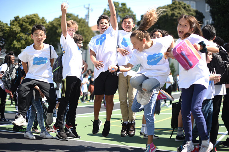 Excited students at a volunteering day with Salesforce at Presidio Middle School