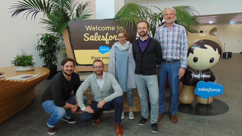 Staff of nonprofit customer, Condrobs e. V. Inside, meet with Salesforce employee, Sebastian Munkelt, at Salesforce’s Munich office.