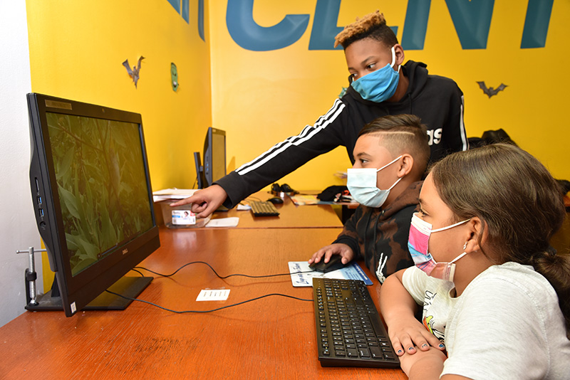 Kids doing virtual learning while wearing masks