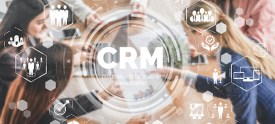 Image of people having a meeting with a CRM graphic overlaid