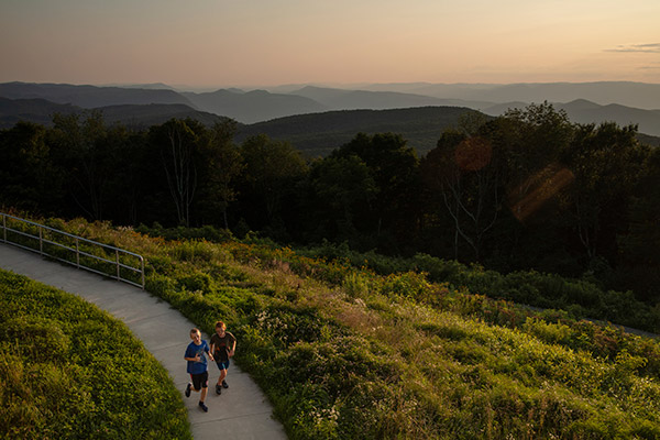 Kids run on a path above the High Knob overlook in Norton, Virginia.
