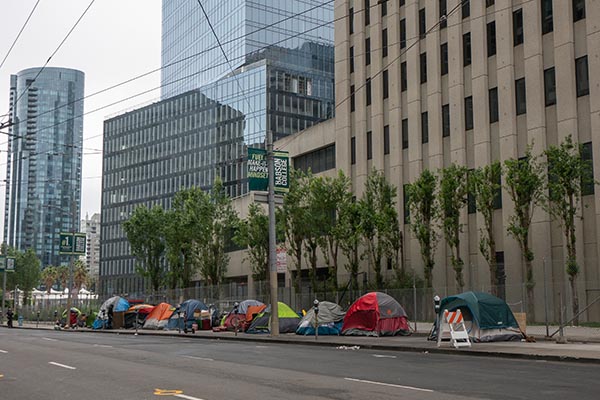 Tents lining the street in a downtown area