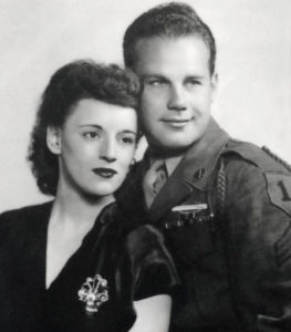 A black and white image of a man and a woman