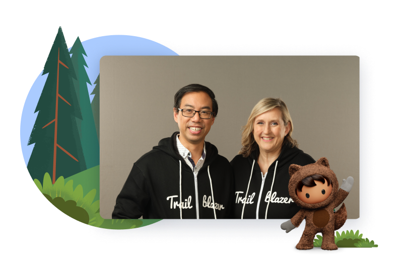 A man and a woman in matching sweatshirts that say Trailblazer Community