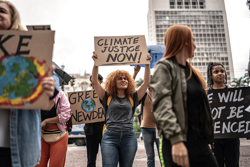 People holding signs and protesting climate change