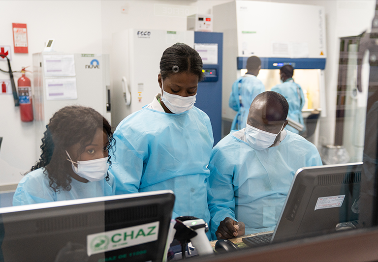 Cynthia Banda Cassande and colleagues in a HIV testing lab at the CHAZ Laboratory in Lusaka, Zambia.